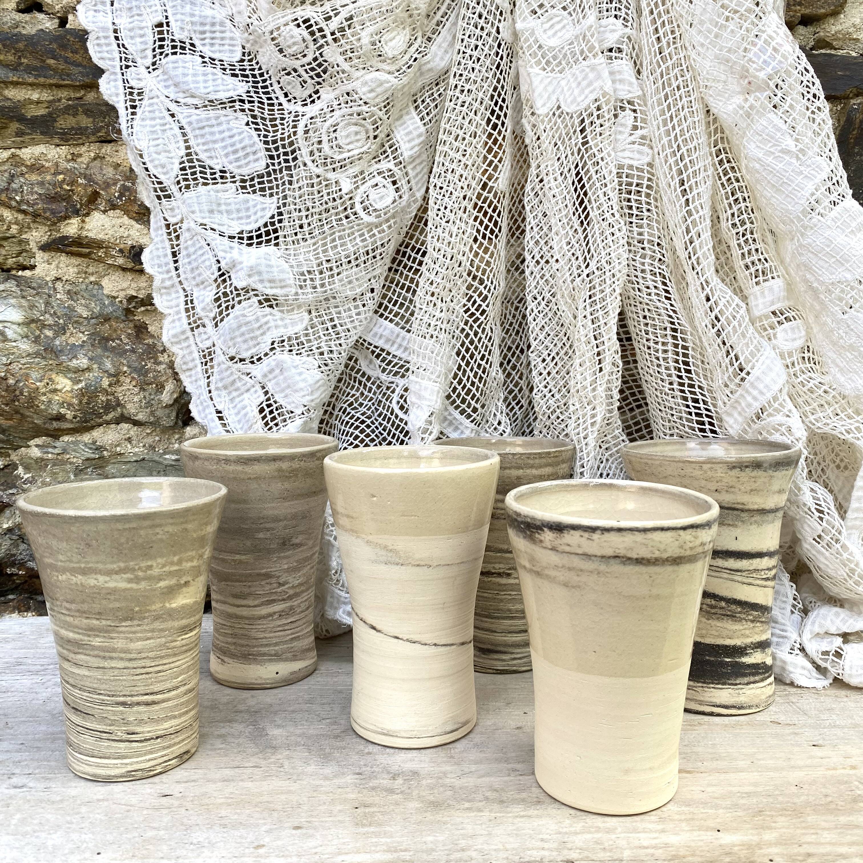 High ceramic cups made of mixed clay.
