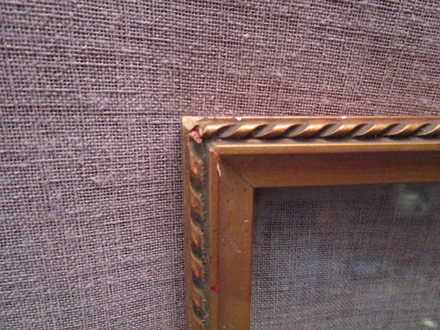 Old wooden and gilded stucco frame