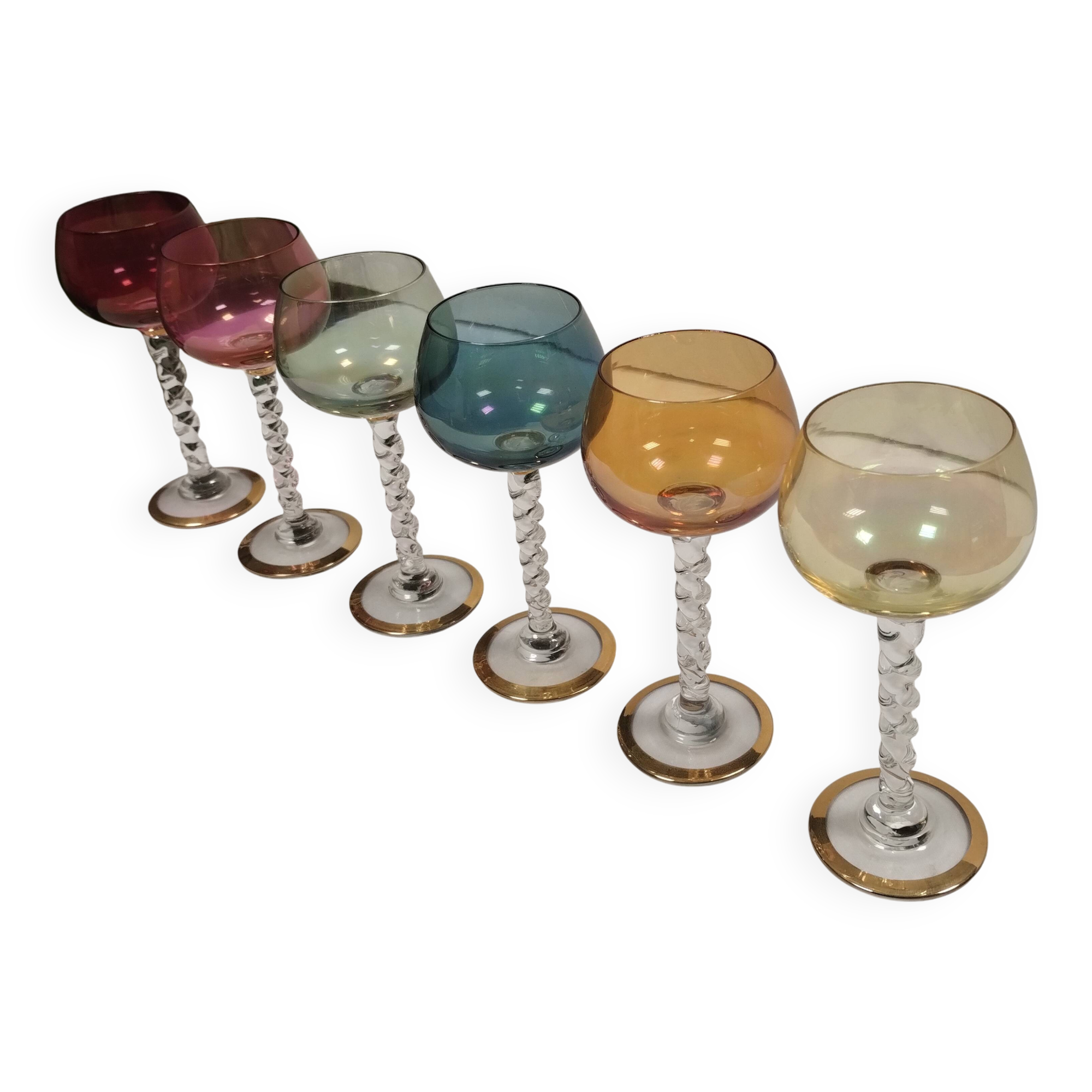 Set of 6 colored crystal stemmed glasses with gold twisted foot.