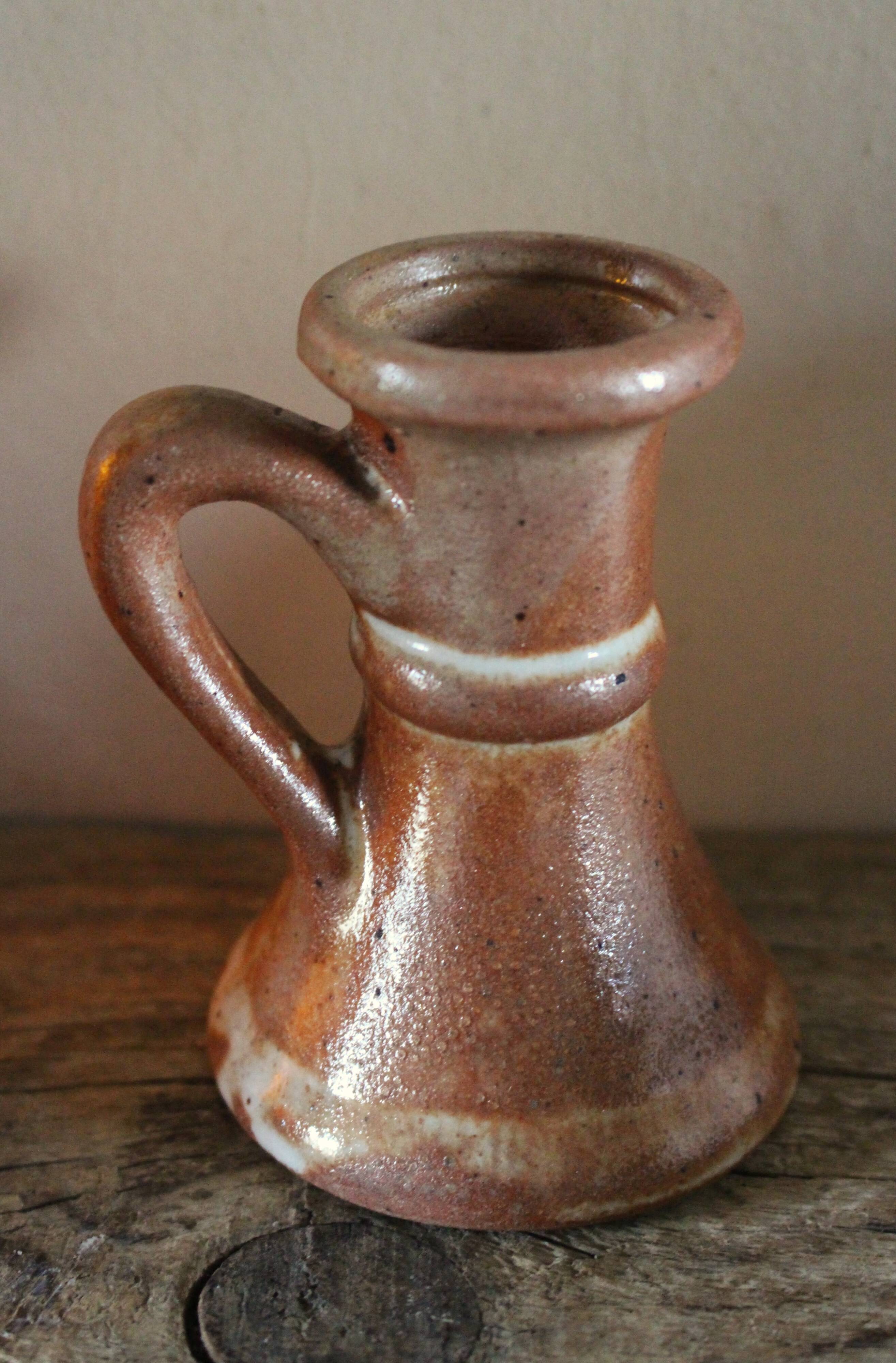 Small vintage marbled stoneware candlestick with handle