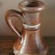 Small vintage marbled stoneware candlestick with handle