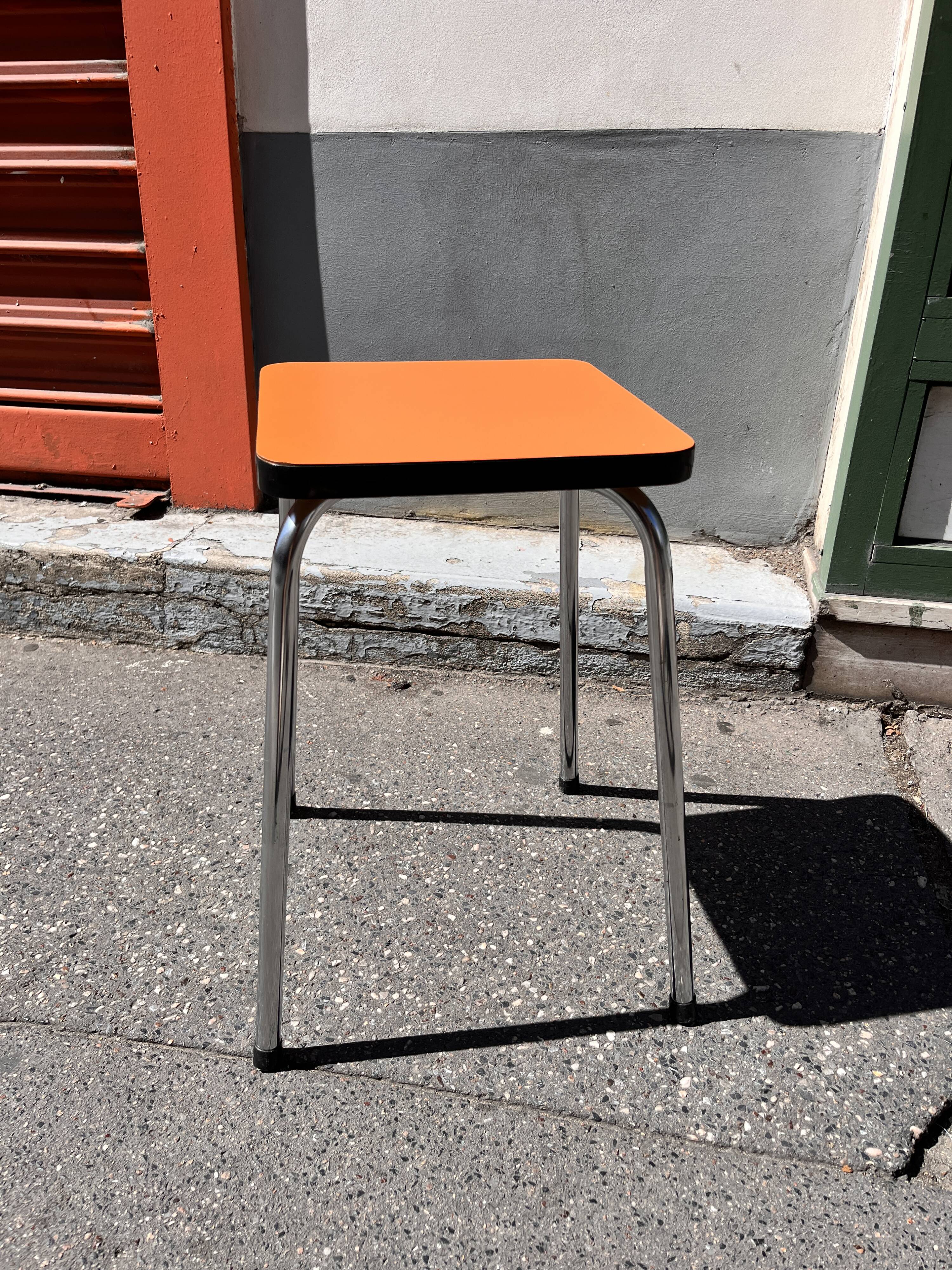 Orange Formica stool