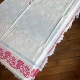 Old cotton tablecloth with flowers and fringes