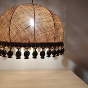 Large hanging pendant light with a burlap and pom-pom style
