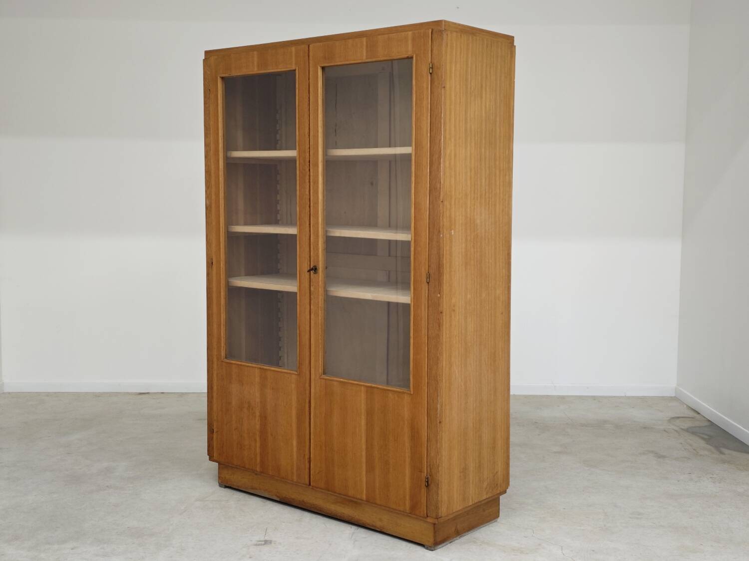 Oak glass-fronted school cabinet 1960