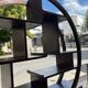 Round galay shelf on bahut sideboard