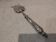 Fish serving fork with 950 silver handle, rococo cherub design