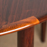Danish extendable dining table in Rio Rosewood model 55 by Arne Vodder for Sibast 1958.