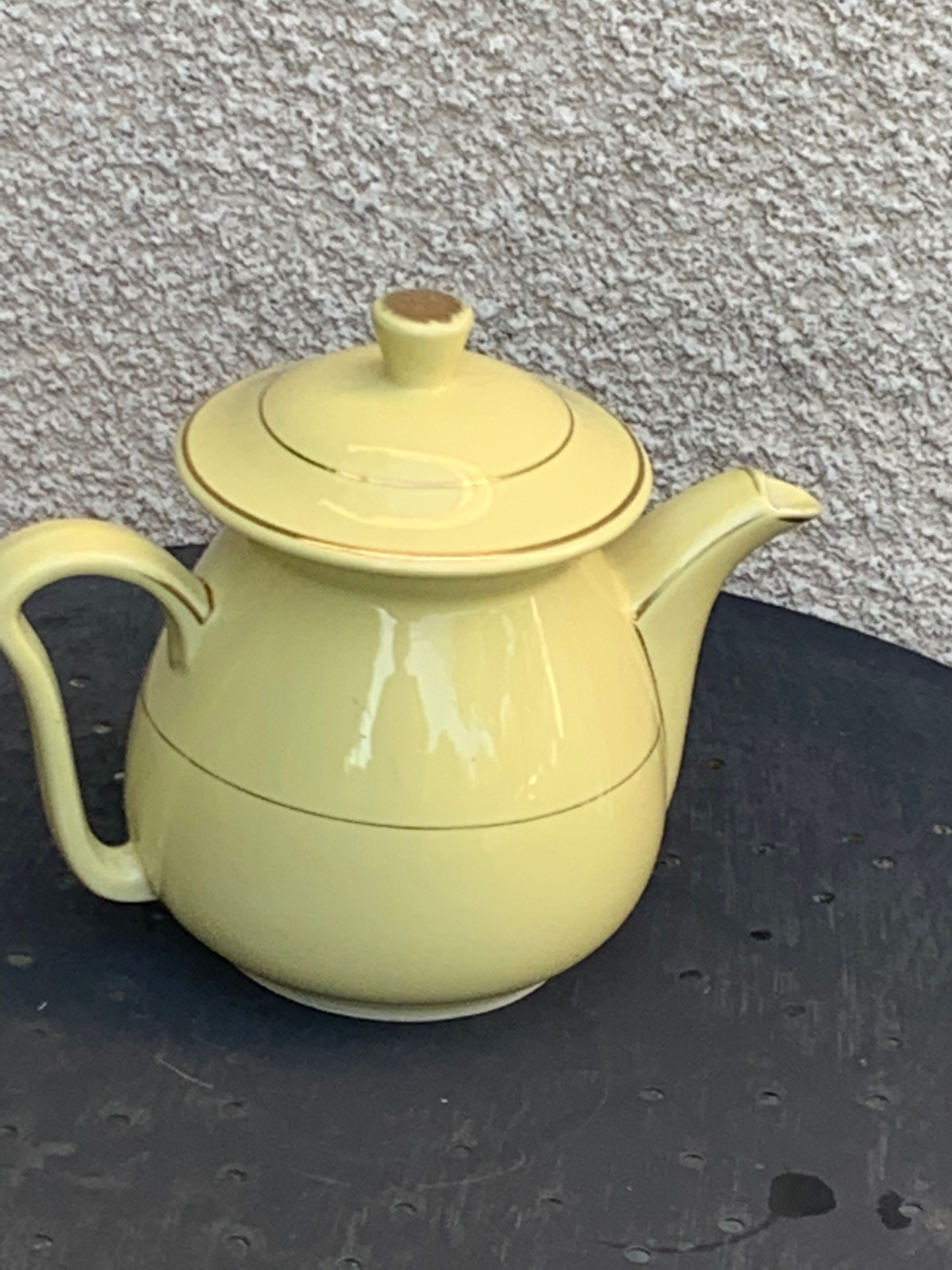 Teapot, yellow earthenware coffee maker and vintage gold edging