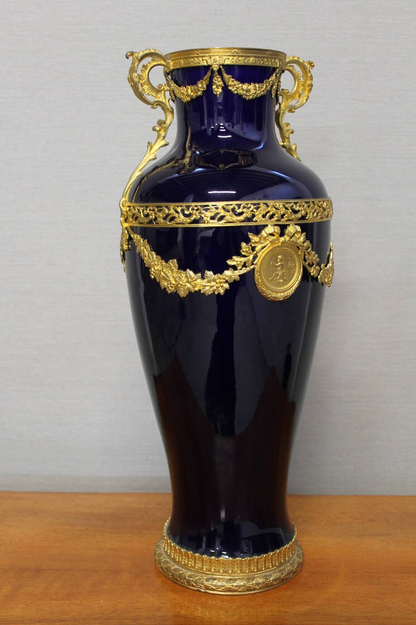 Vase signed Legastelois in blue ceramic of Sèvres and gilded bronze