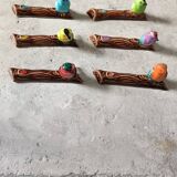 Set of six barbotine bird knife rests