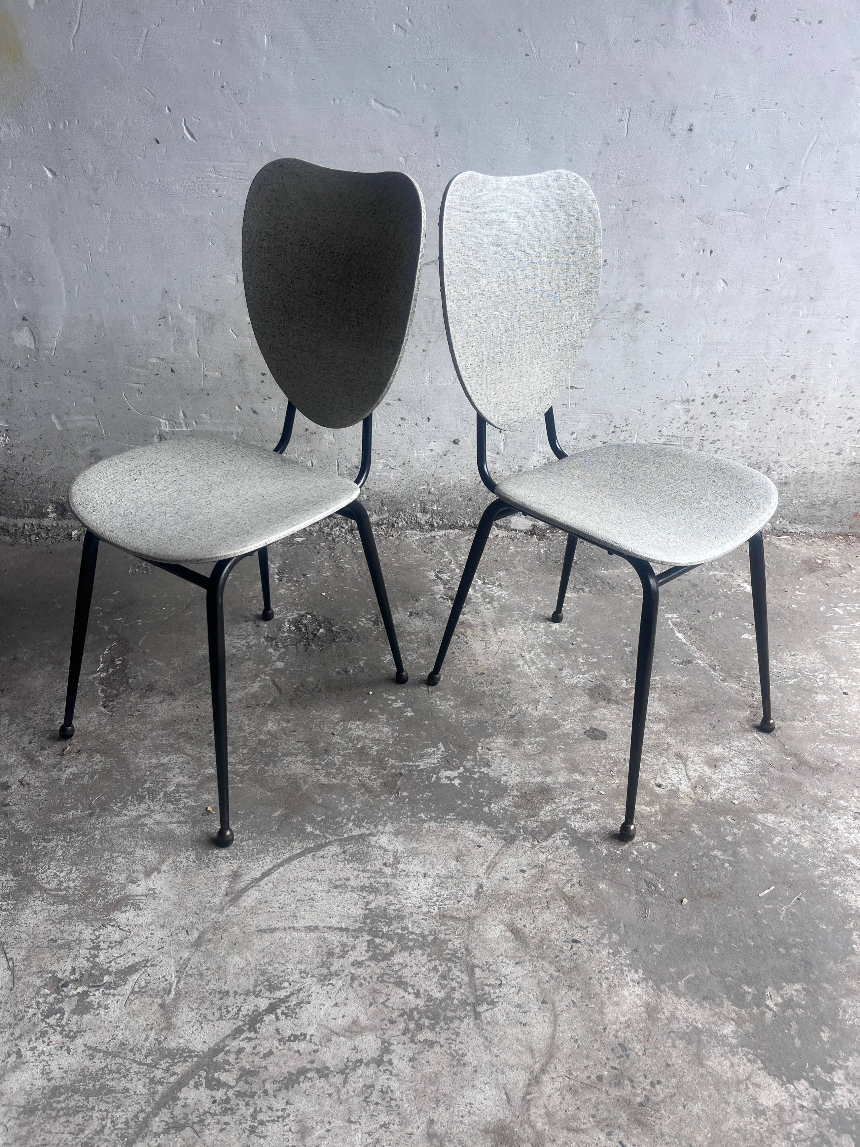 Elegant pair of French dining chairs by Jacques Hitier from the 1950s.