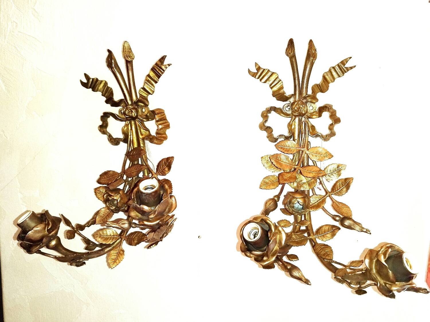 Pair of bronze and gilded metal wall sconces in the Louis XVI style.