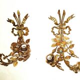 Pair of bronze and gilded metal wall sconces in the Louis XVI style.