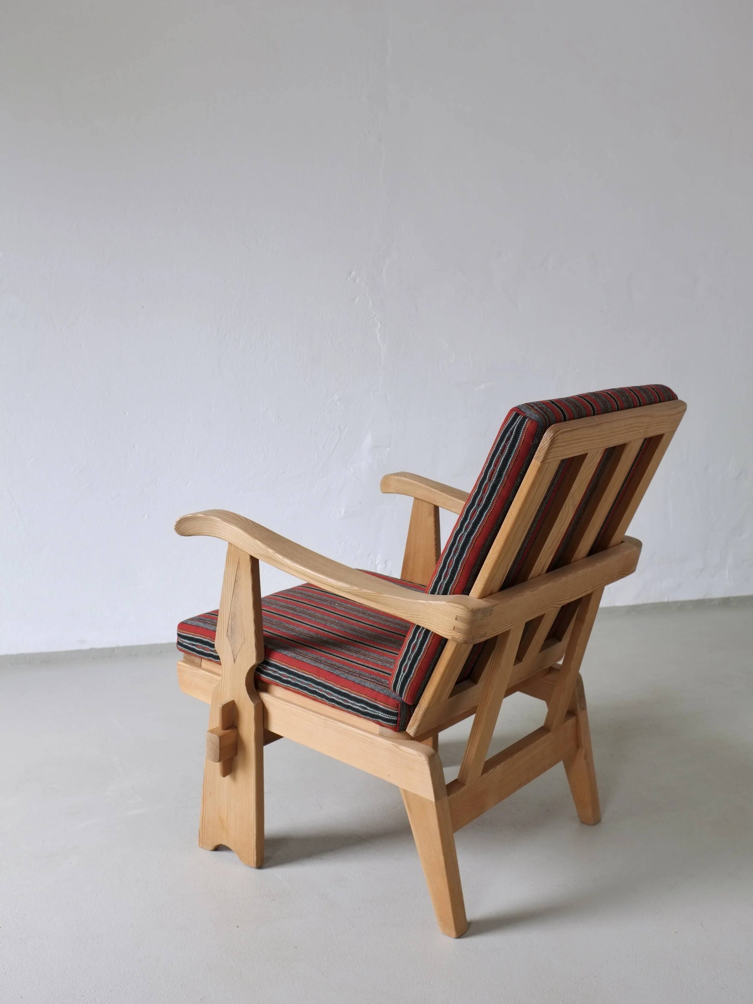 2 carved pine lounge chairs | Scandinavia | 1970s