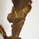 Pair of simple vintage French wall sconces in Art Nouveau bronze with leaf-shaped details.