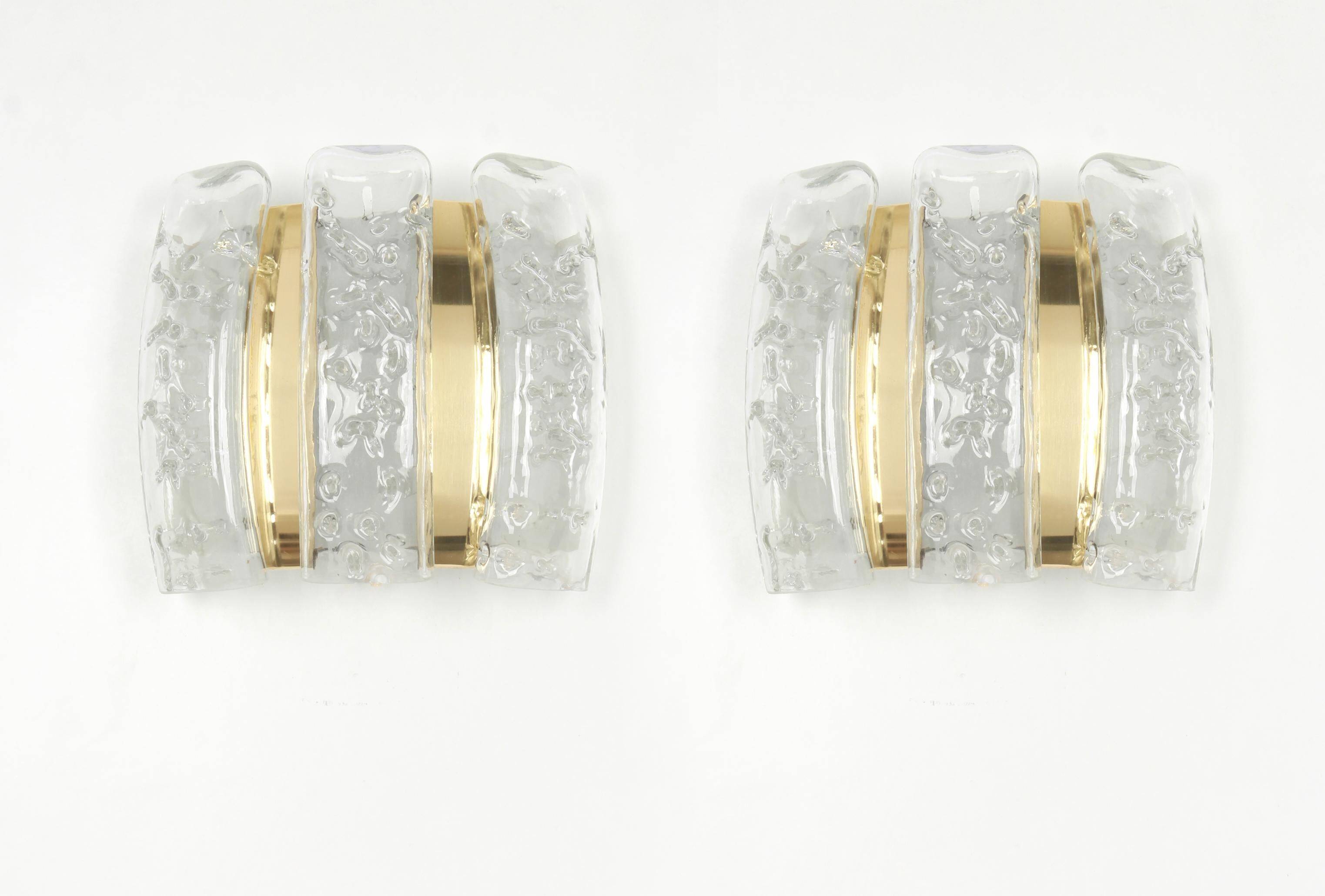 Pair of wall sconces in brass or ice glass by Doria, Germany, 1960s.