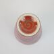 Small orange glazed ceramic cup