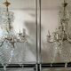 A pair of imposing, antique chandeliers with pendants.
