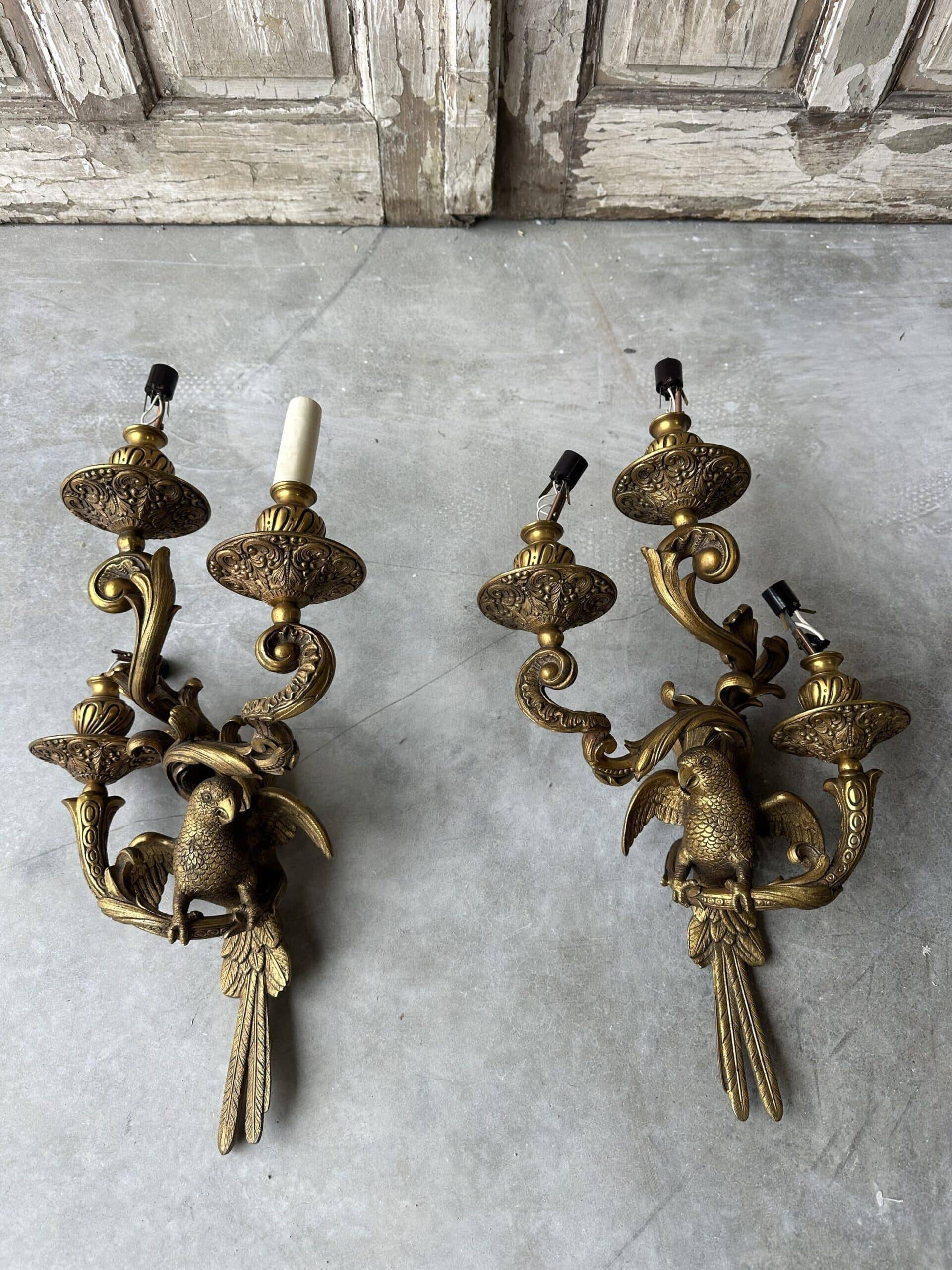 Pair of bronze wall sconces with parrots, early 20th century.