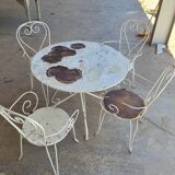 Renovated round table and garden armchairs