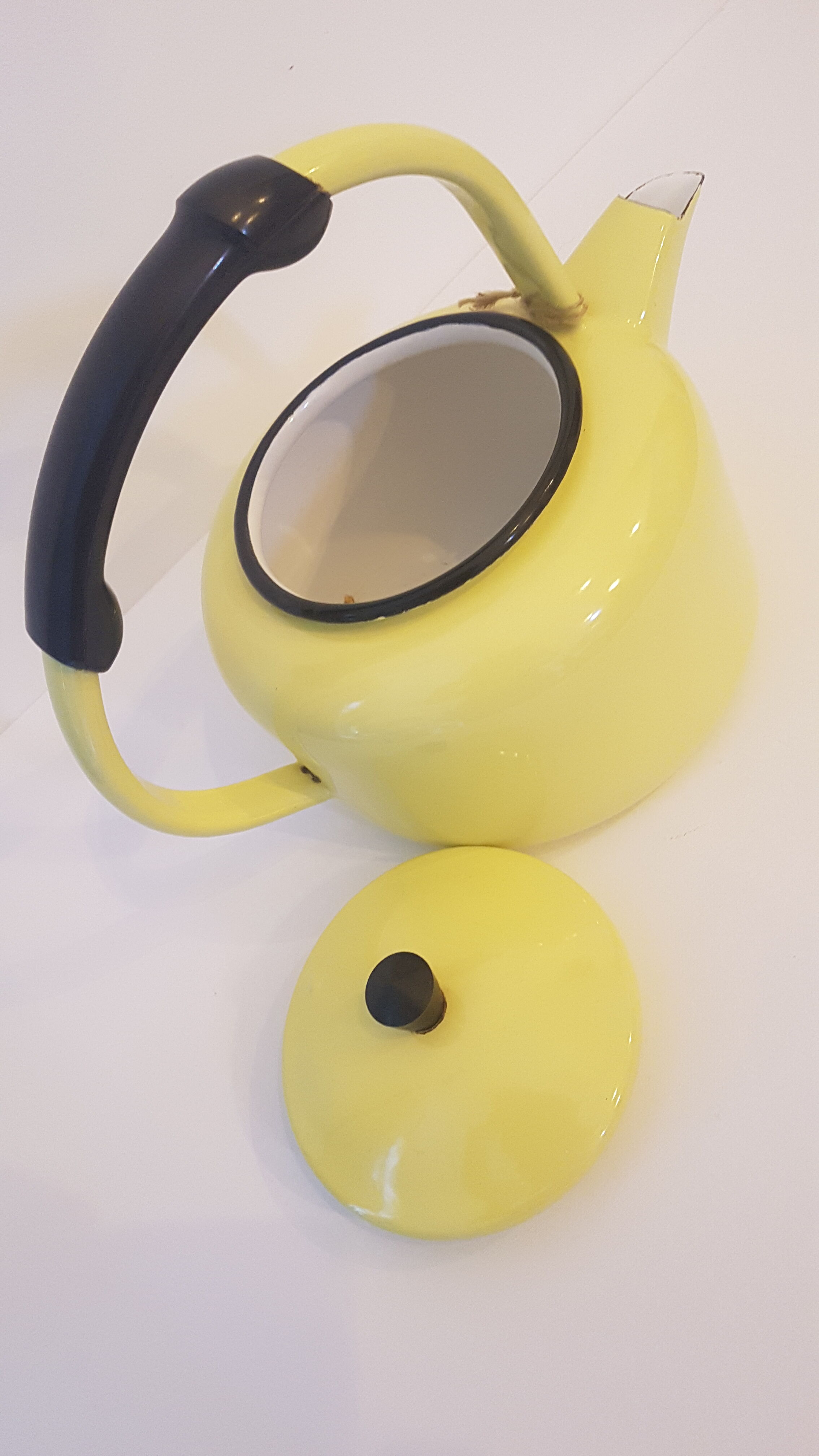 Old kettle enamelled pale yellow