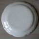 Antique polychrome earthenware plate from eastern France with flower decoration, 19th century