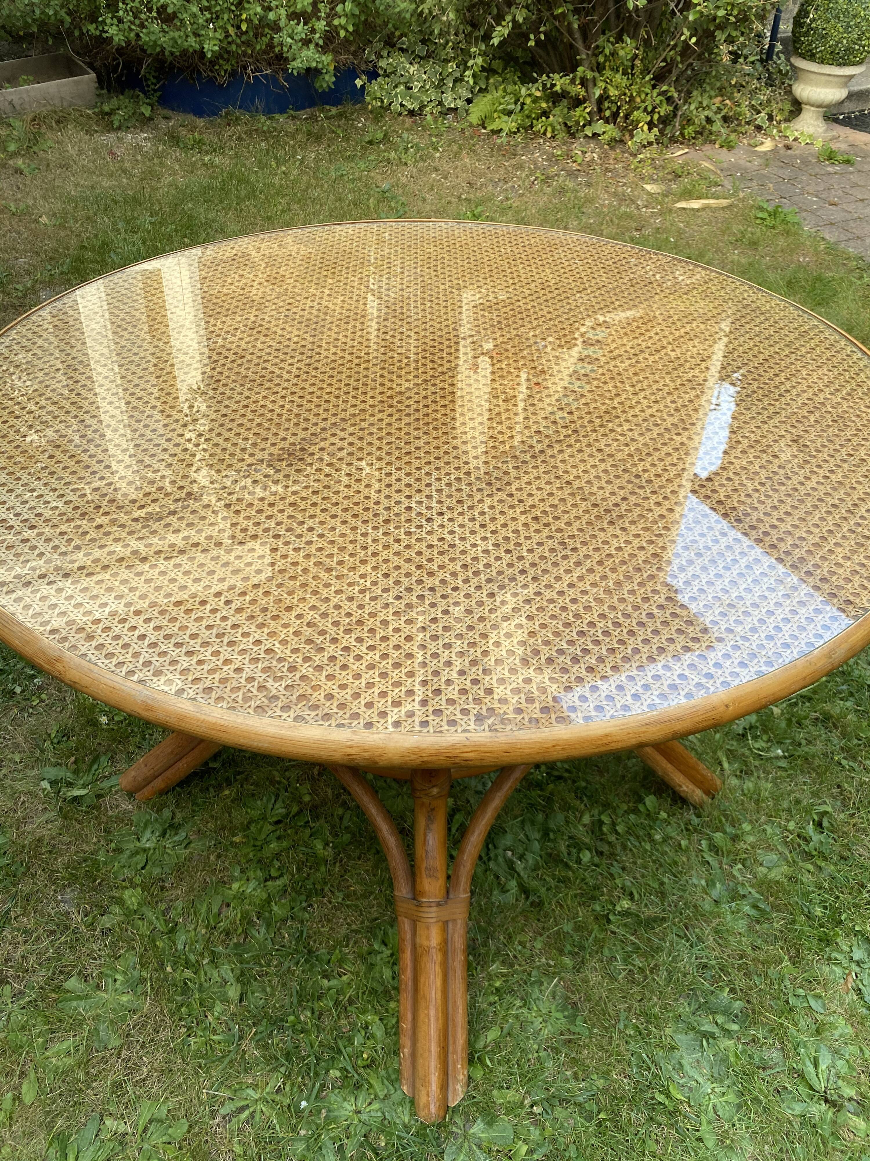 Canned rattan dining table and vintage glass