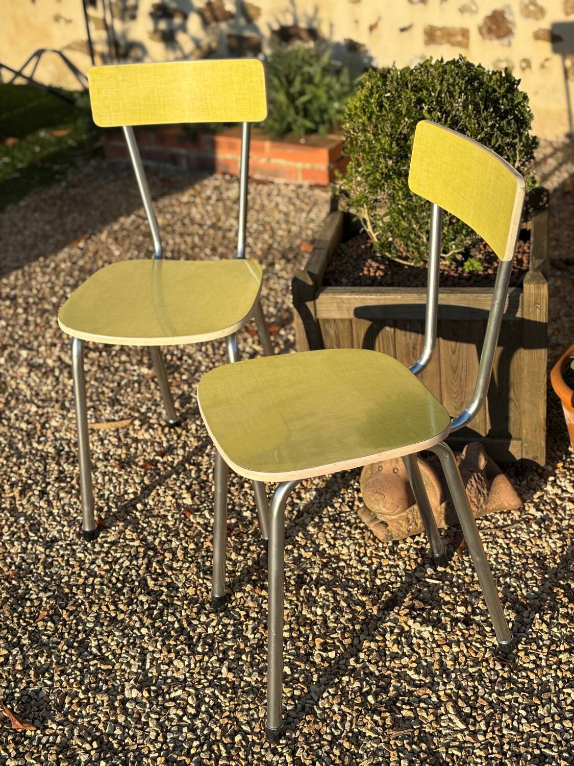 Pair of yellow Formica chairs