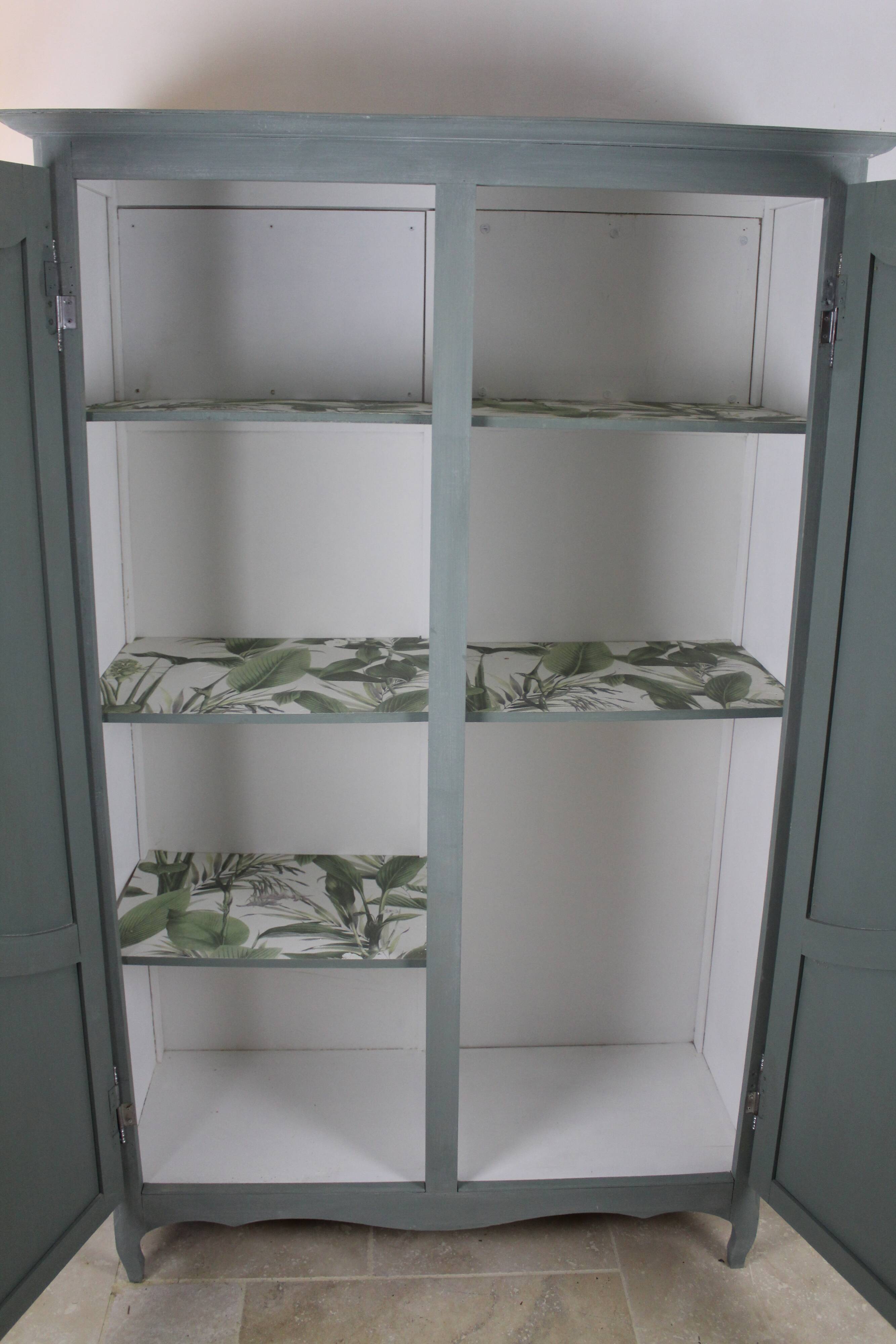 Renovated Parisian wardrobe – sage green with white patina