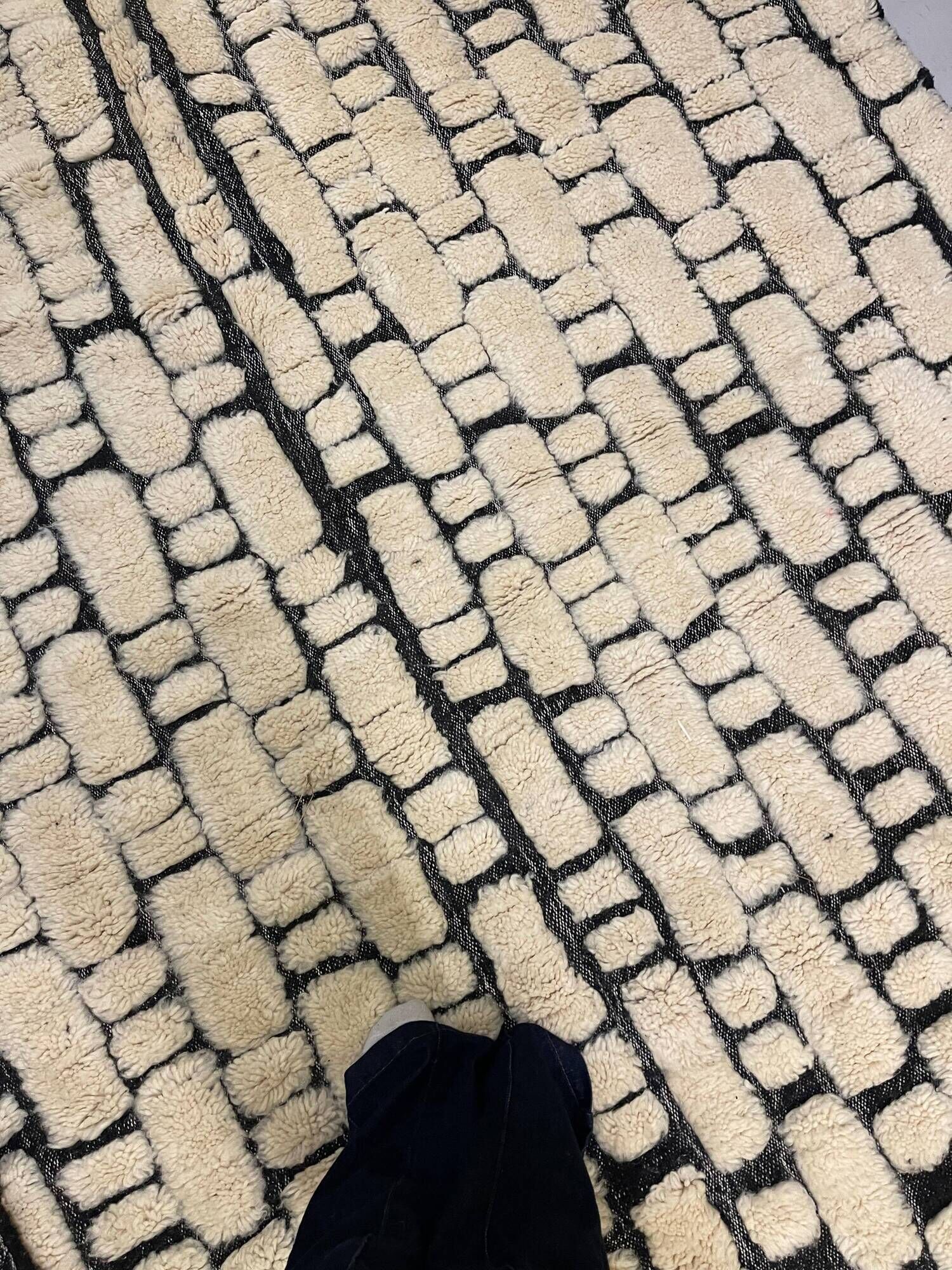 Large cream and black checked Berber rug, 280 × 200 cm.