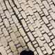 Large cream and black checked Berber rug, 280 × 200 cm.