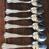 A set of 7 large metal shell spoons