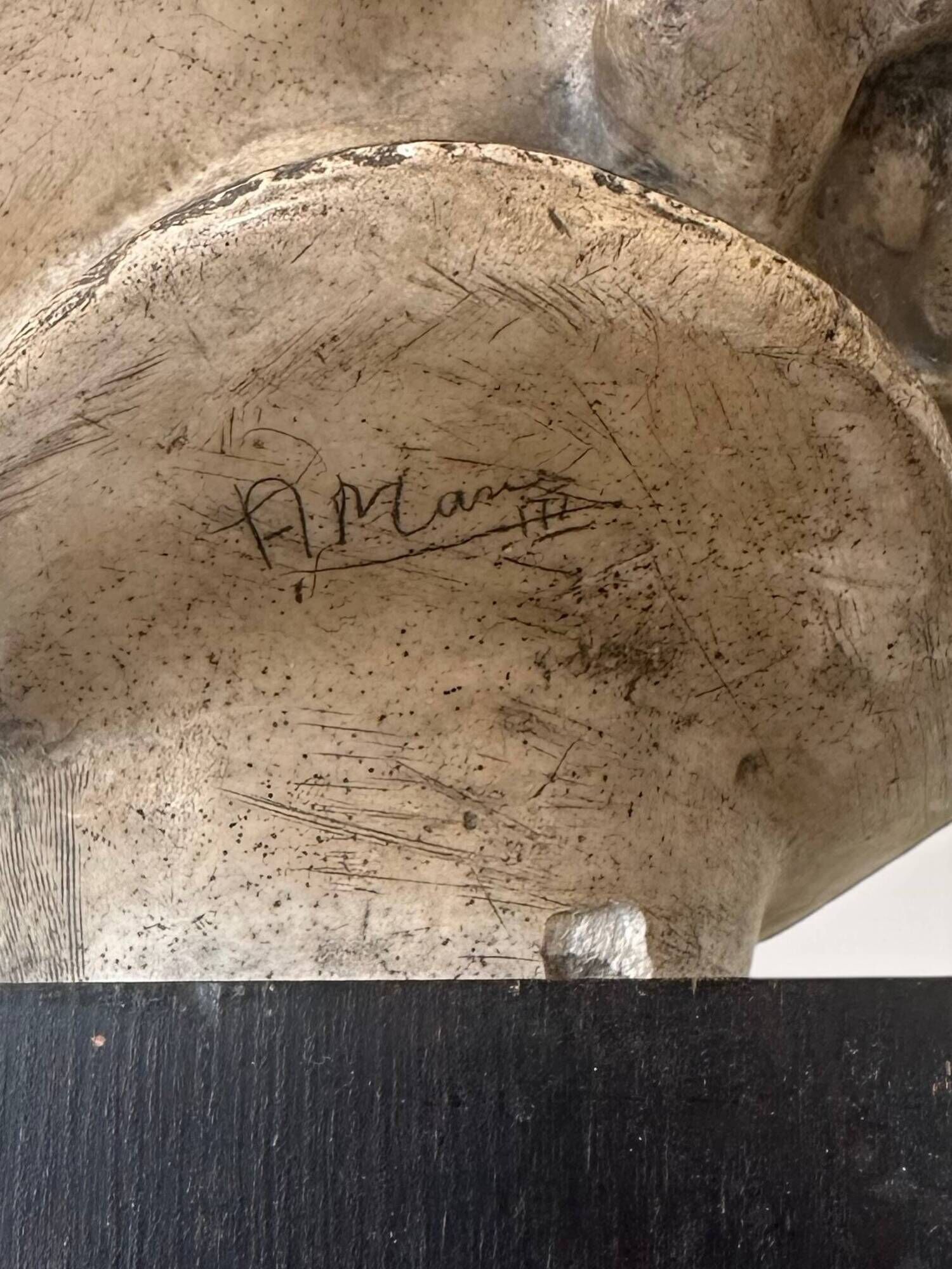 Plaster bust on a wooden base