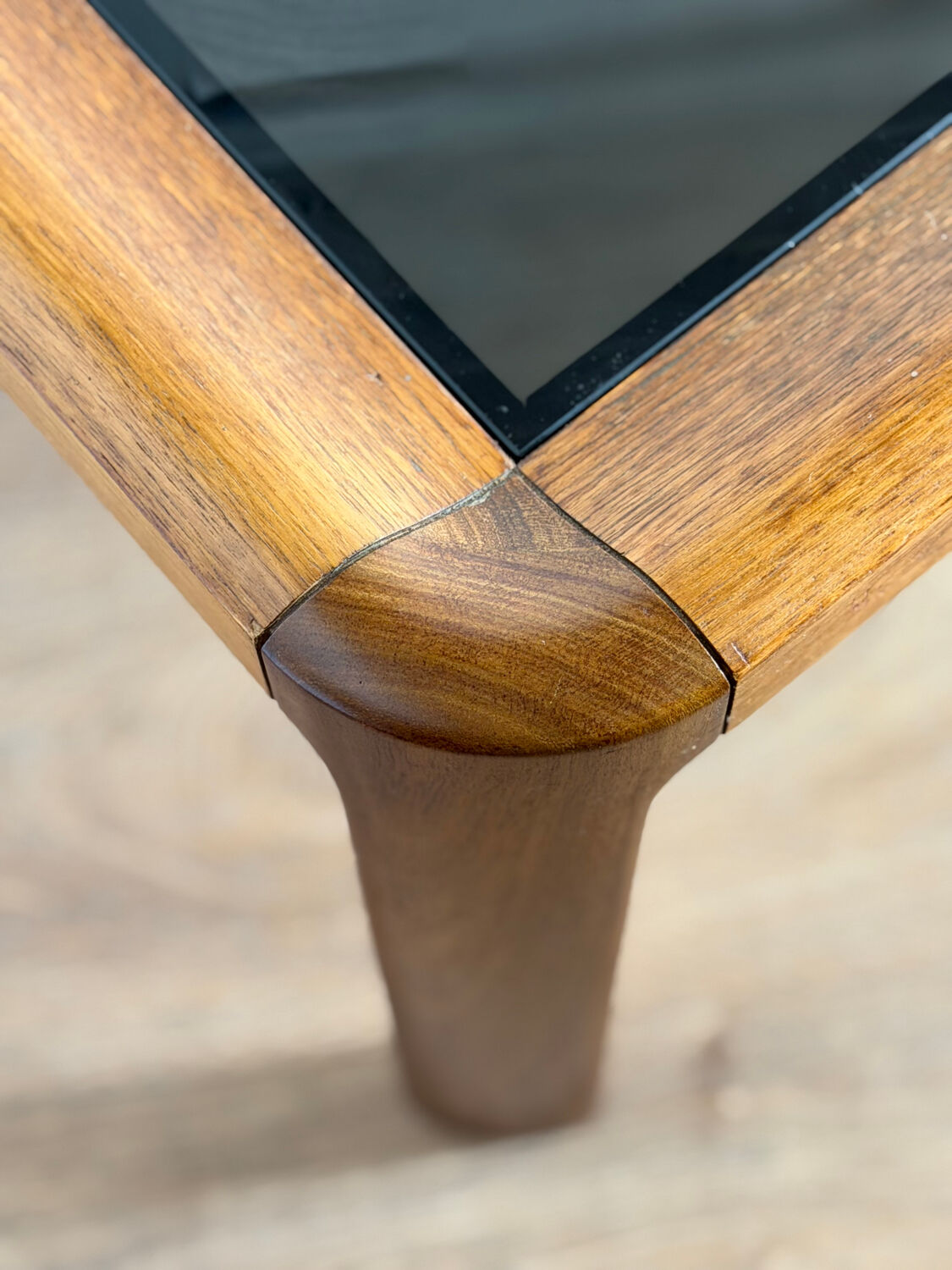 Large Scandinavian coffee table in teak and smoked glass.
