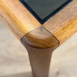 Large Scandinavian coffee table in teak and smoked glass.