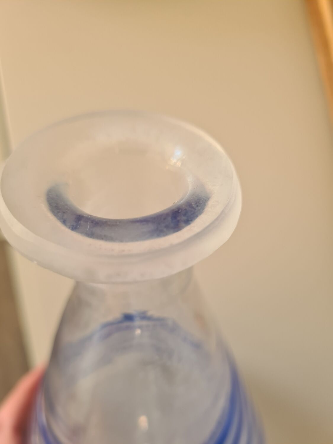 Conical glass vase/carafe blown with a blue spiral decoration.