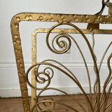 Vintage wrought iron magazine rack with gold butterfly design