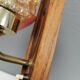 Small, stylish wall lamp with rosewood suspension and hard pressed glass