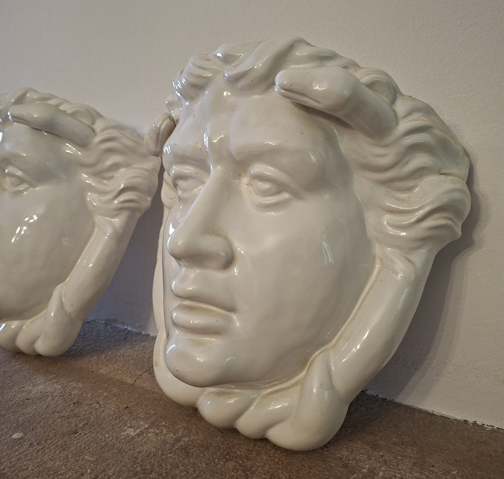 Pair of white glazed ceramic wall planters