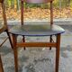 2 Scandinavian chairs in teak and black imitation leather, 1960s