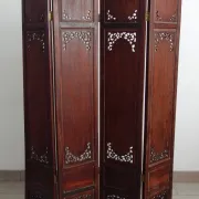 Asian screen in carved wood and mother-of-pearl marquetry.