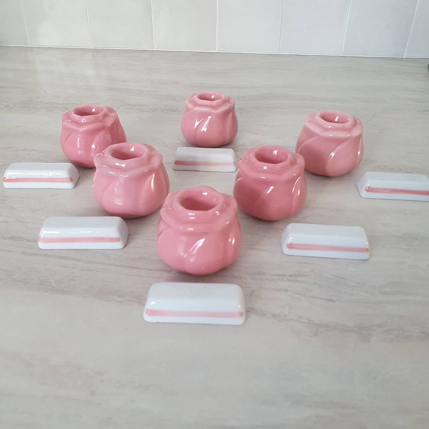 Pink candlesticks and porcelain knife holders