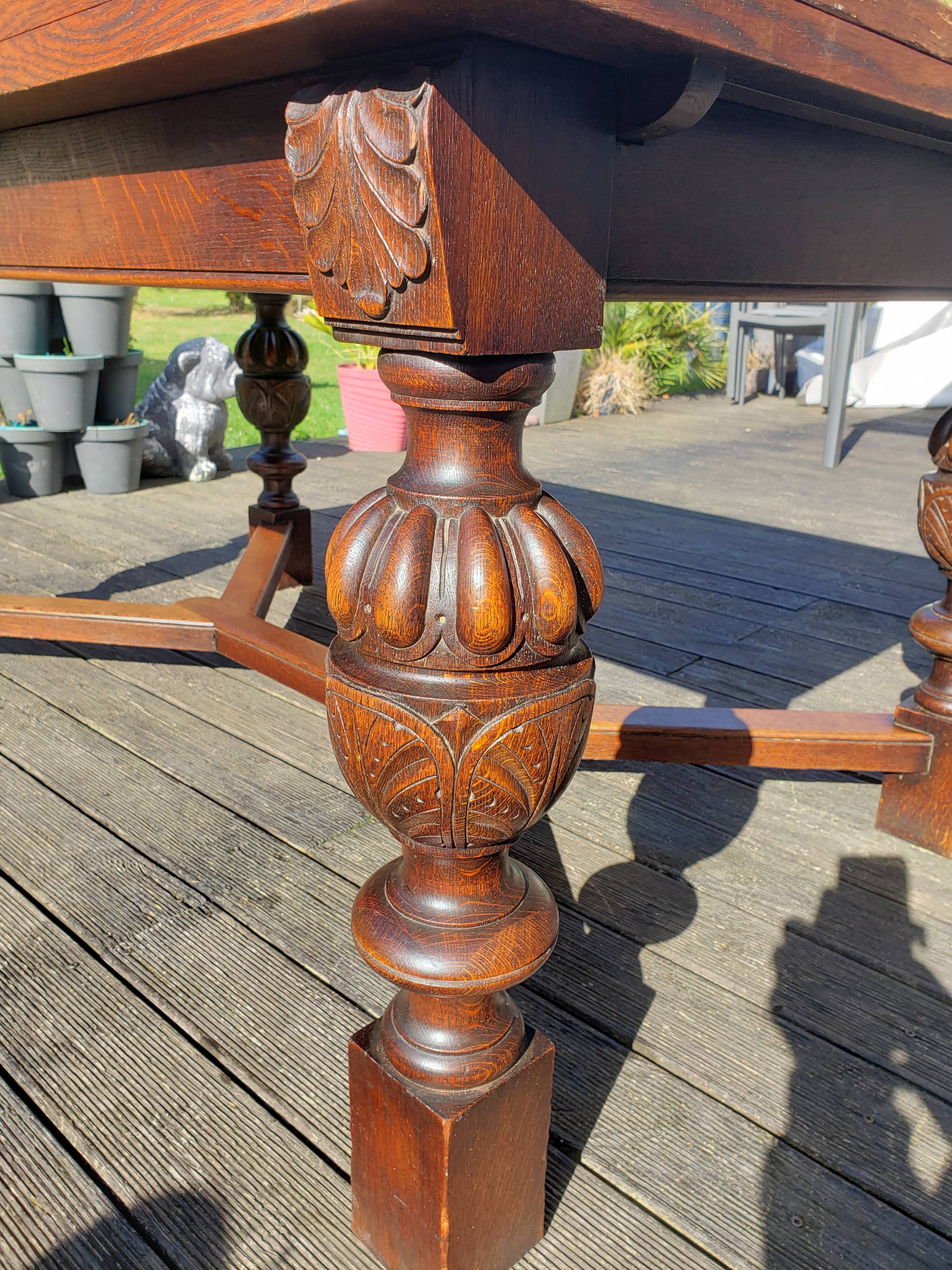 1910s Jacobean style solid oak extending drawer dining table