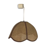 Two-tone flower hanging in braided straw.