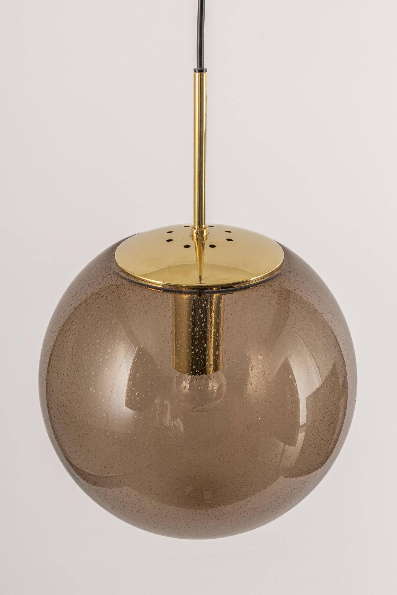 Large smoked glass ball pendant by Limburg in brass, Germany, 1970s.