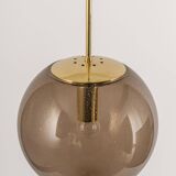 Large smoked glass ball pendant by Limburg in brass, Germany, 1970s.