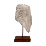 Carved stone head sculpture