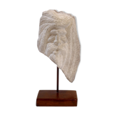 Carved stone head sculpture