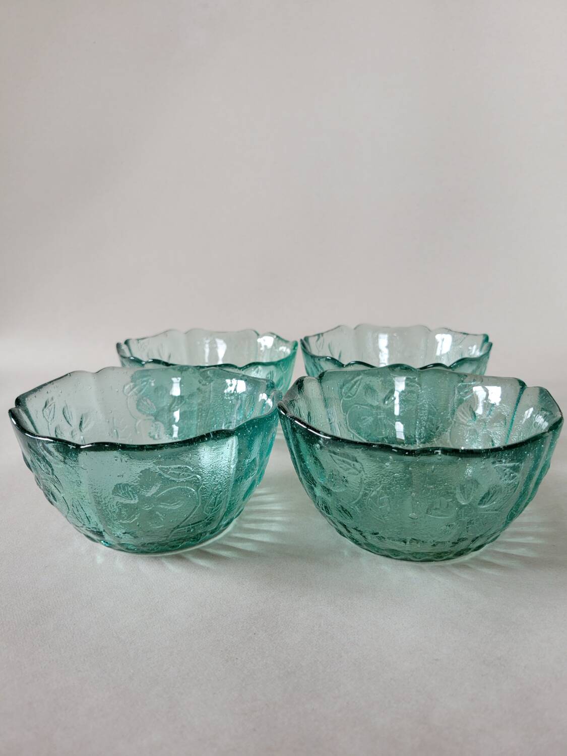 4 ramekins with embossed designs